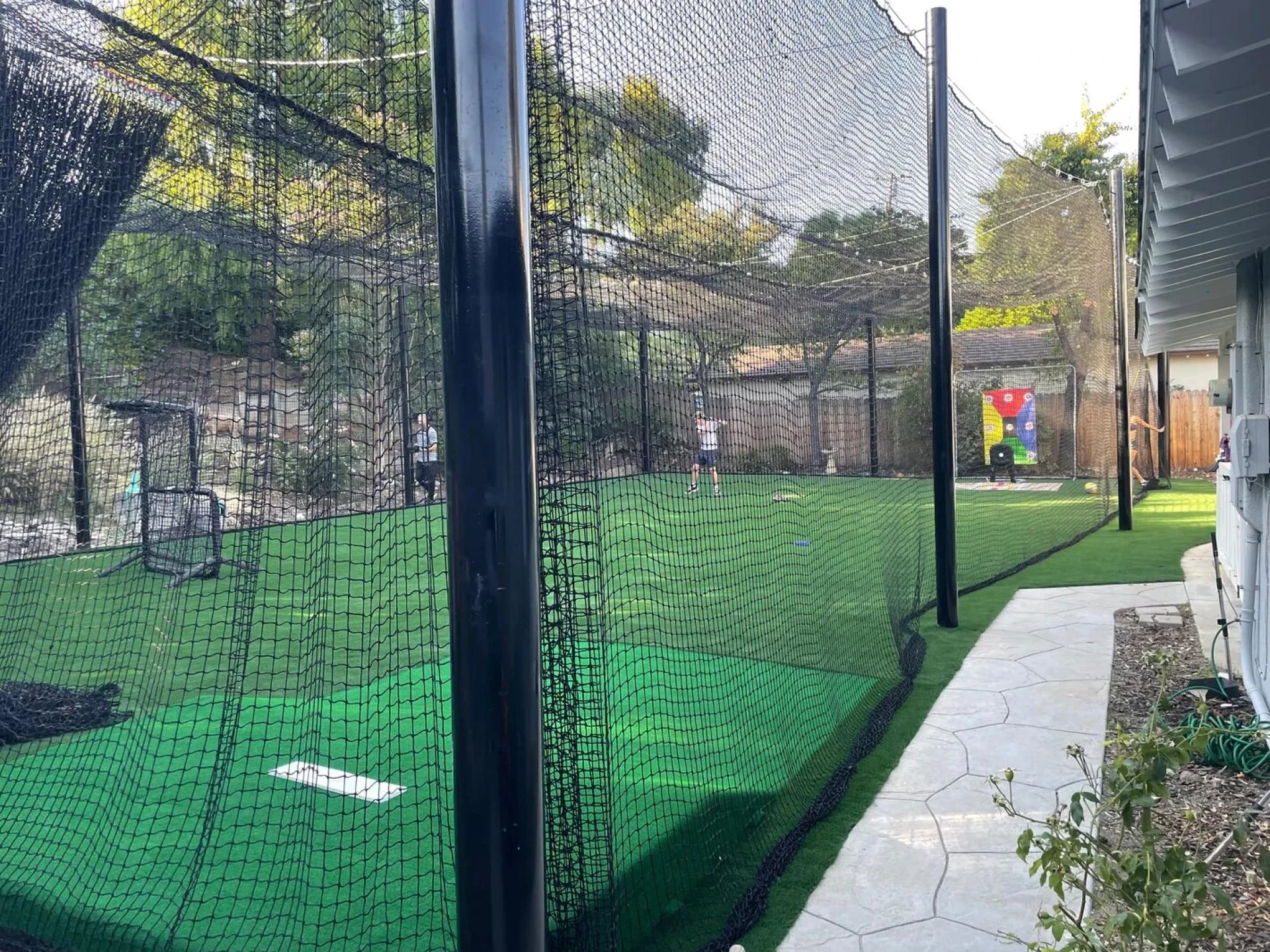 Batting Cage Nets and Pitching Machines: A Winning Combo